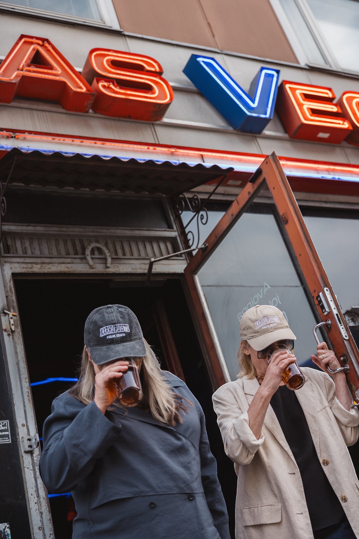 Elina Knihtilä and Pirjo Lonka in Kallio, wearing FC Karhupuisto caps by Karhupuisto Film Festival. Picture taken by Timea Slavic.