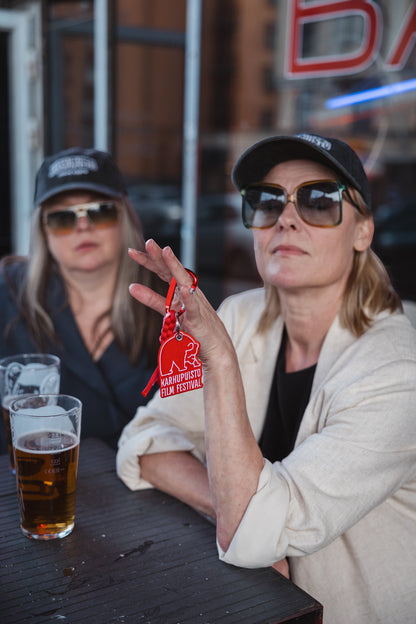 Elina Knihtilä and Pirjo Lonka in Kallio, wearing FC Karhupuisto caps by Karhupuisto Film Festival. Picture taken by Timea Slavic.