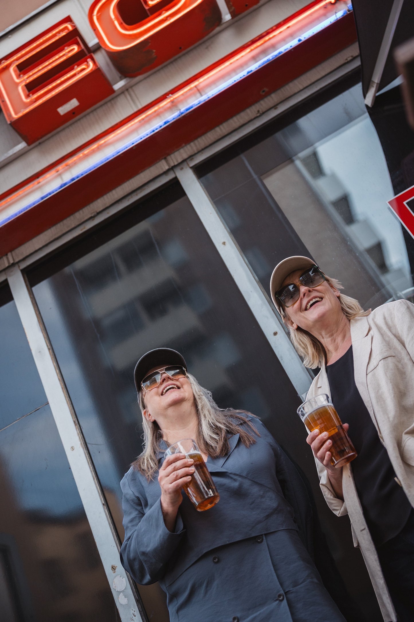 Elina Knihtilä and Pirjo Lonka in Kallio, wearing FC Karhupuisto caps by Karhupuisto Film Festival. Picture taken by Timea Slavic.