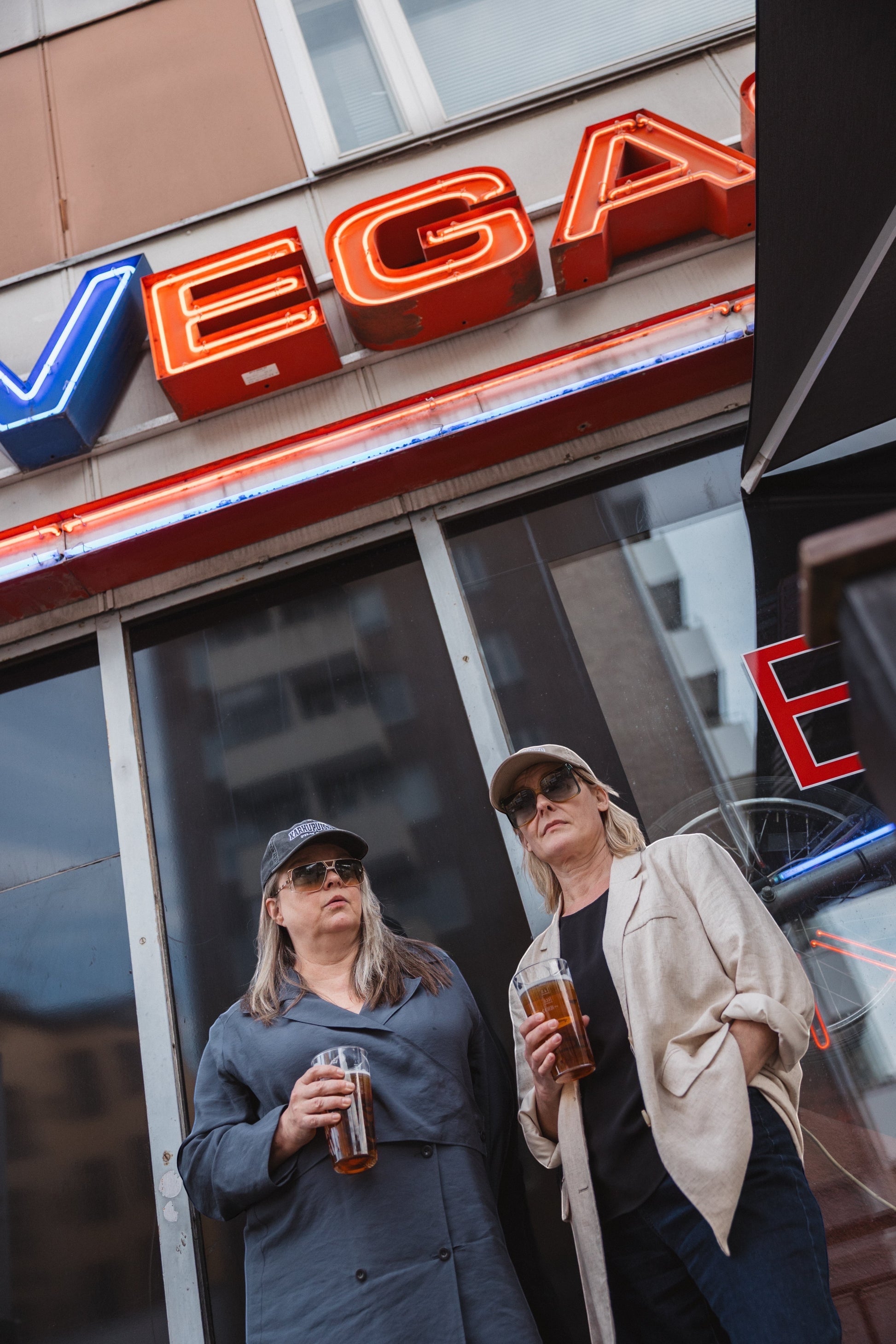 Elina Knihtilä and Pirjo Lonka in Kallio, wearing FC Karhupuisto caps by Karhupuisto Film Festival. Picture taken by Timea Slavic.