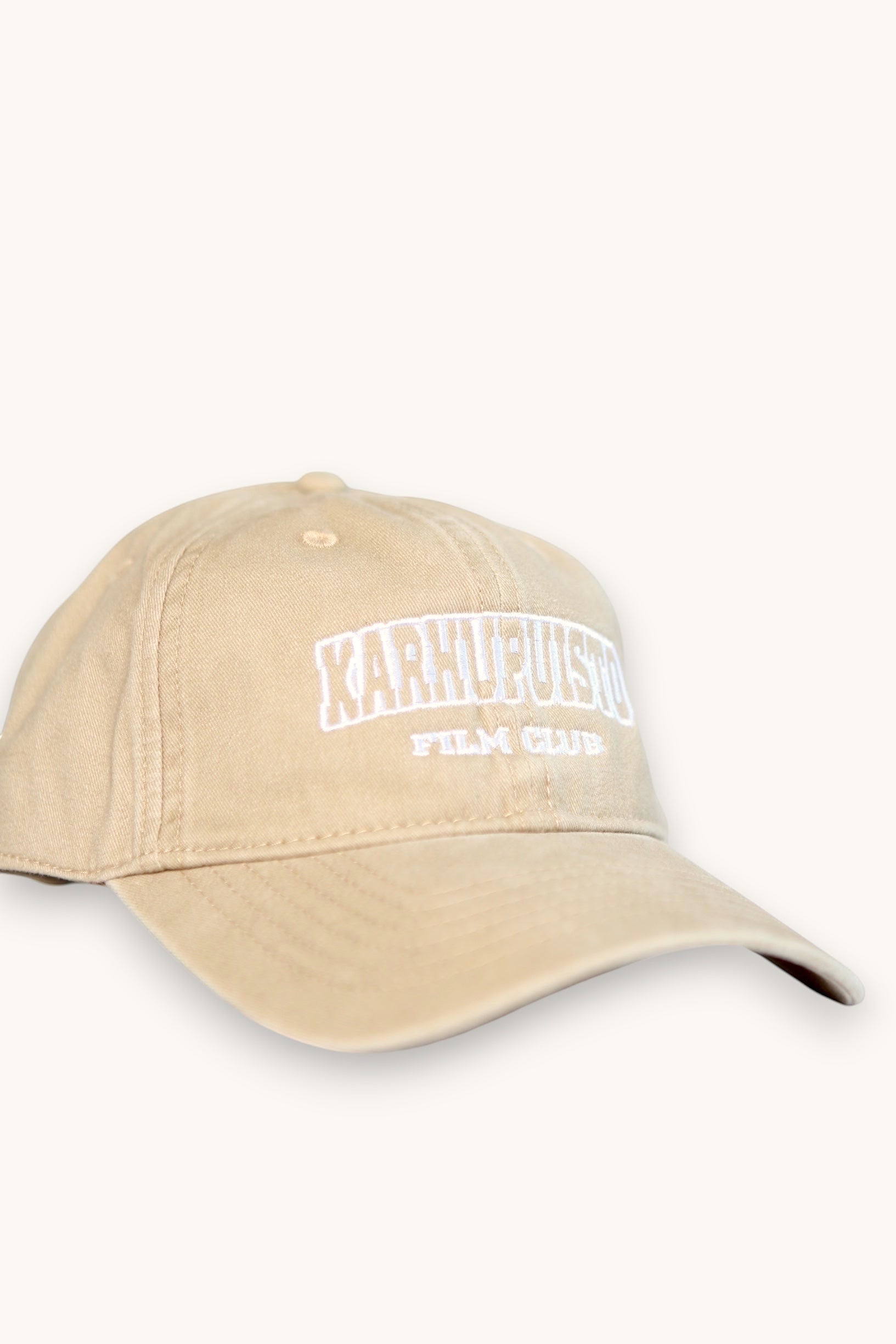 Karhupuisto Film Festival beige cotton baseball cap with white embroidered Film Club lettering on the front.