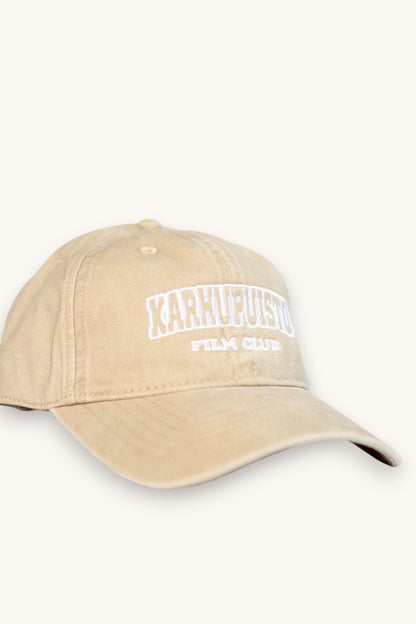 Karhupuisto Film Festival beige cotton baseball cap with white embroidered Film Club lettering on the front.
