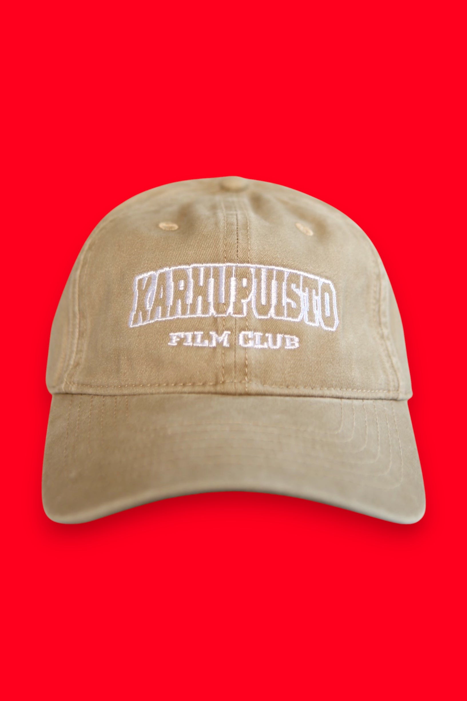 Karhupuisto Film Festival beige cotton baseball cap with white collegiate-style embroidered lettering on the front.