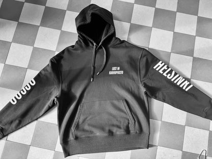 Karhupuisto Film Festival black unisex hoodie with white Lost in Karhupuisto, Helsinki, and 00530 sleeve prints.