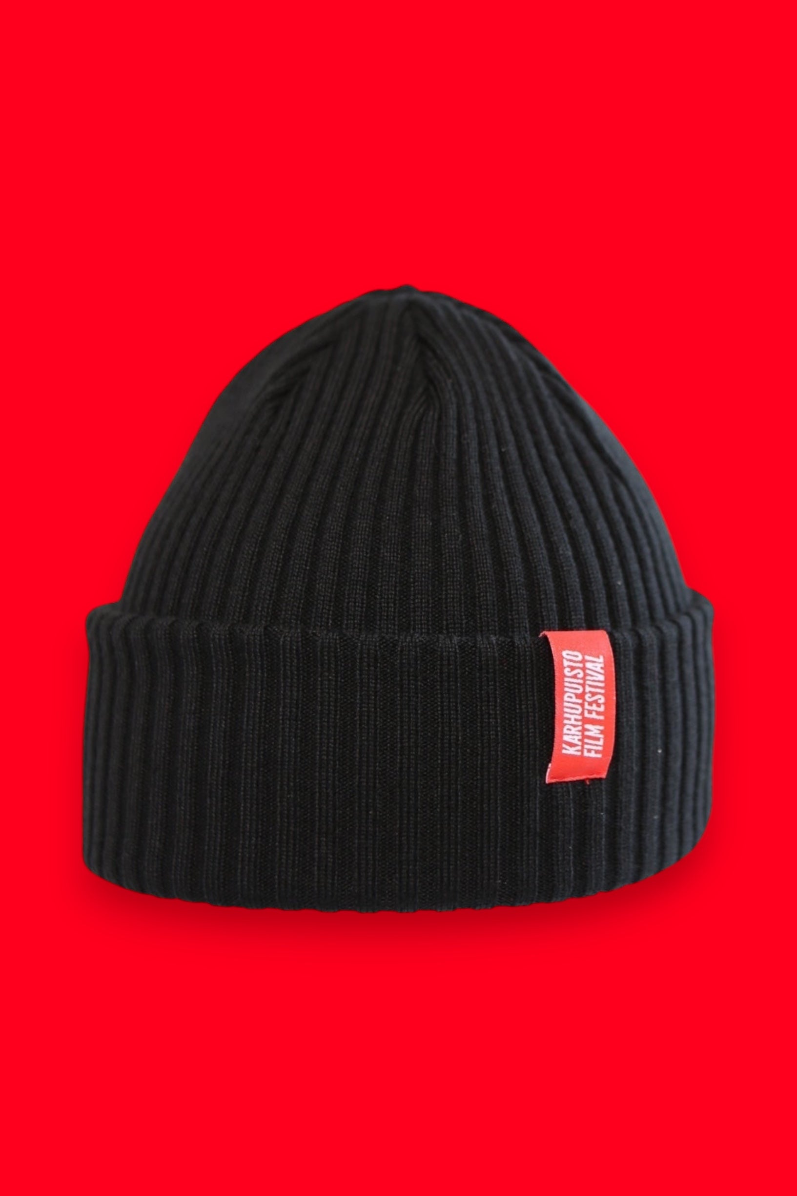 Karhupuisto Film Festival black ribbed knit beanie with a folded cuff and a vibrant red branded woven label