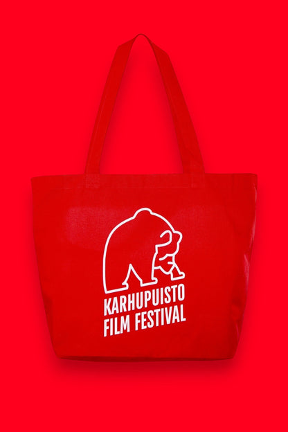 Karhupuisto Film Festival red cotton tote bag with white bear logo print for everyday use.