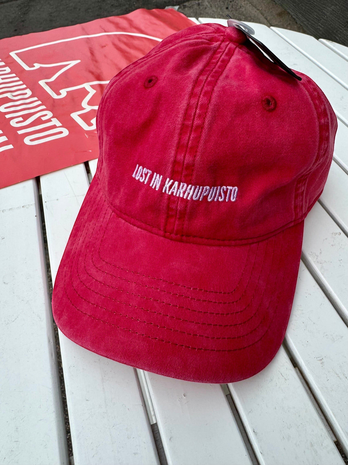 Karhupuisto Film Festival red vintage-washed cotton twill skate cap with white embroidery, up front view